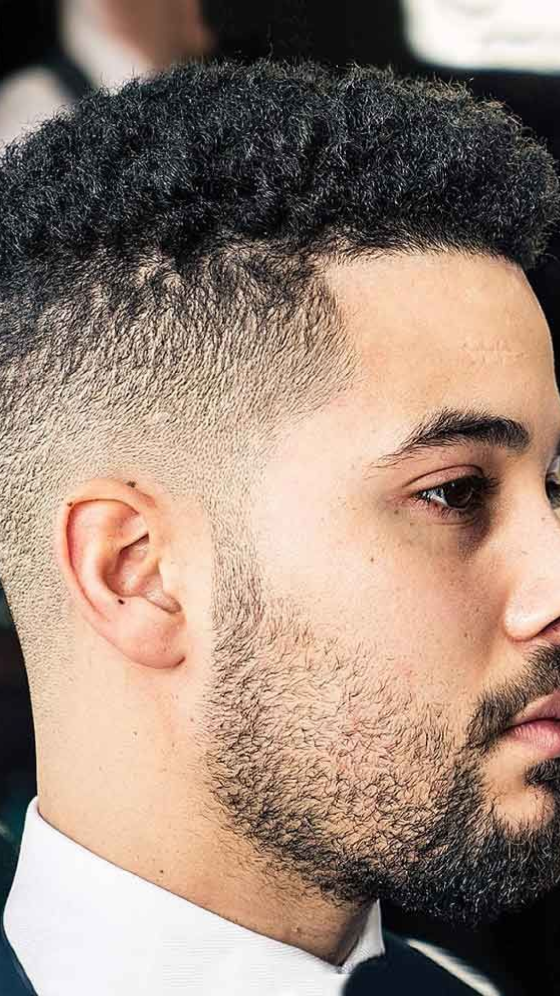 afro with mid fade cut