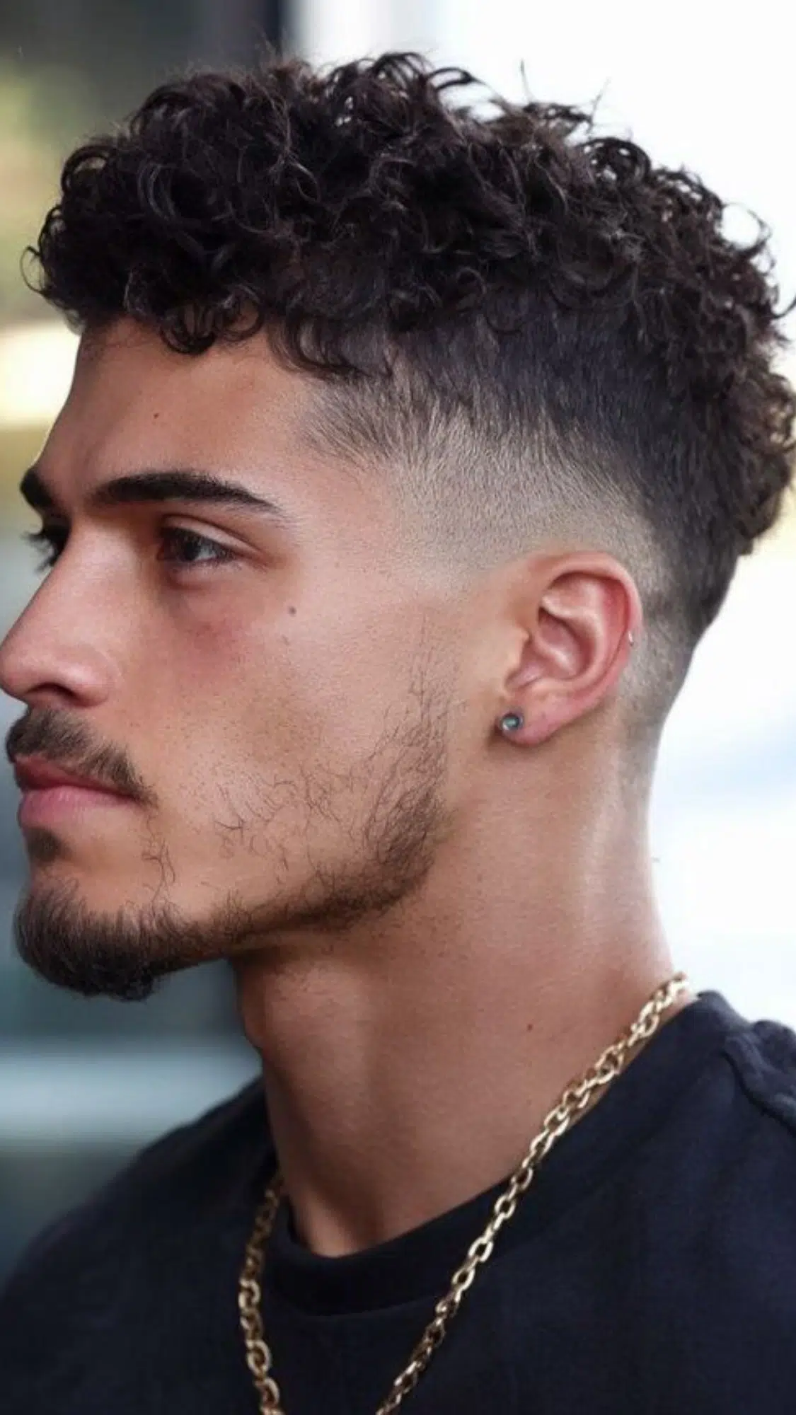 curly top with low fade haircut
