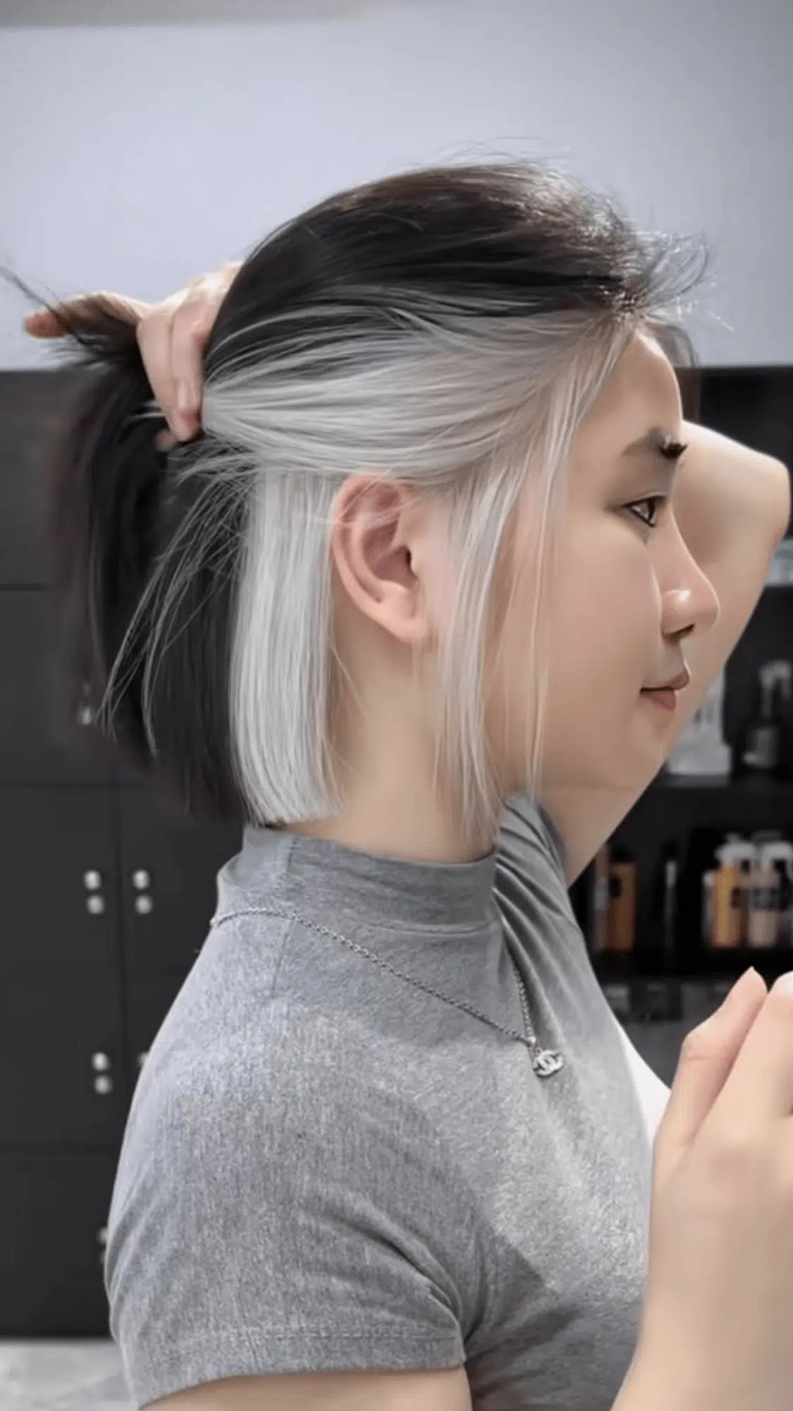 bob cut with silver peekaboo highlights