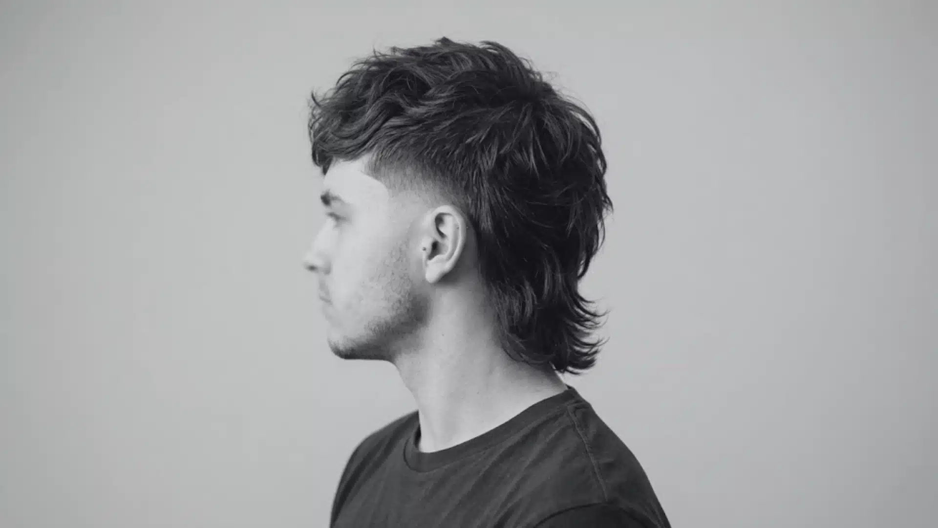 Side profile modern mullet haircut showing why mullets are still popular in 2026