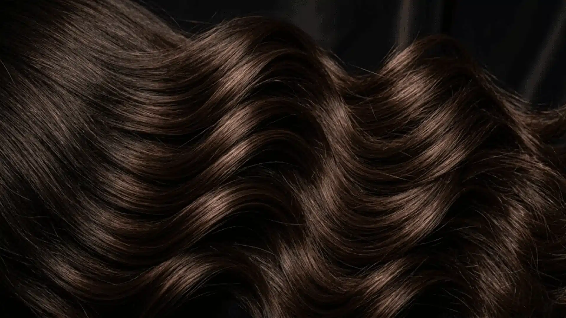 dark brown hair waves with chocolate and espresso lowlights creating rich dimensional shine