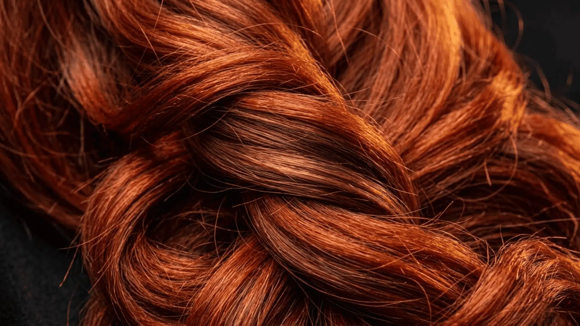 red hair with auburn and cinnamon lowlights showing vibrant warm dimension