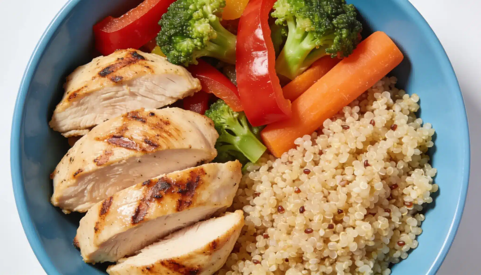 balanced meal with lean protein quinoa and vegetables that support healthy hair growth and thicker hair
