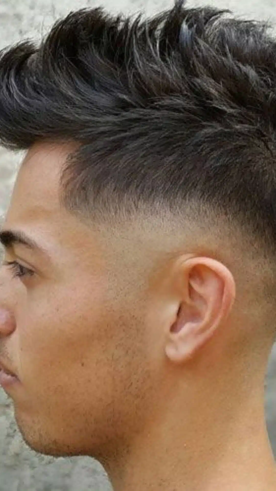 Faux hawk haircut with a high skin fade