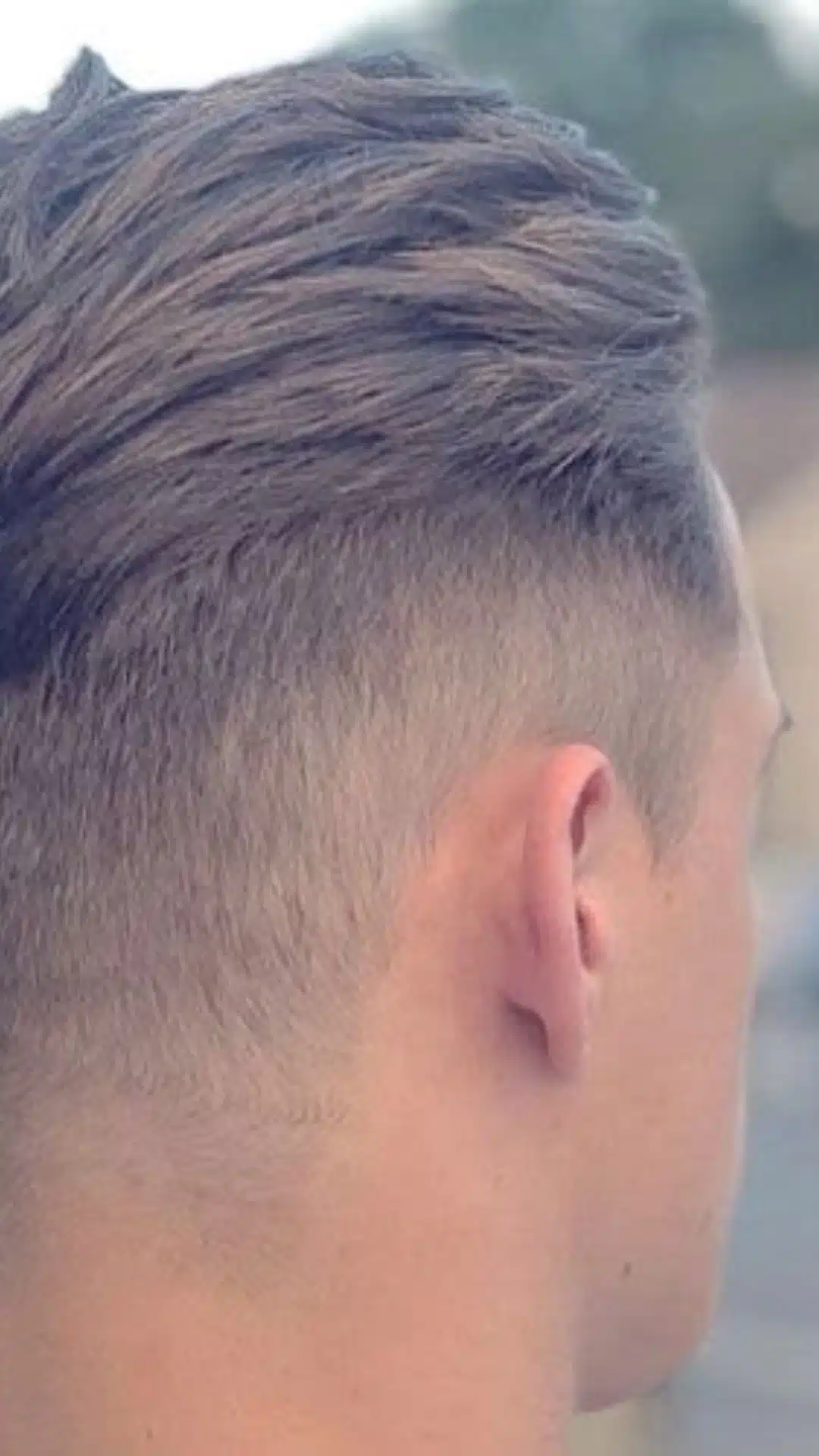 High fade with textured top hairstyle
