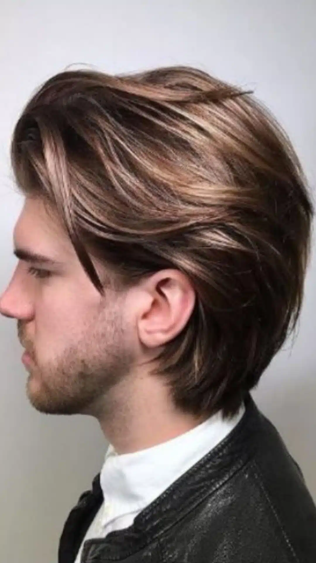 Medium-length layered hairstyle with side-swept hair