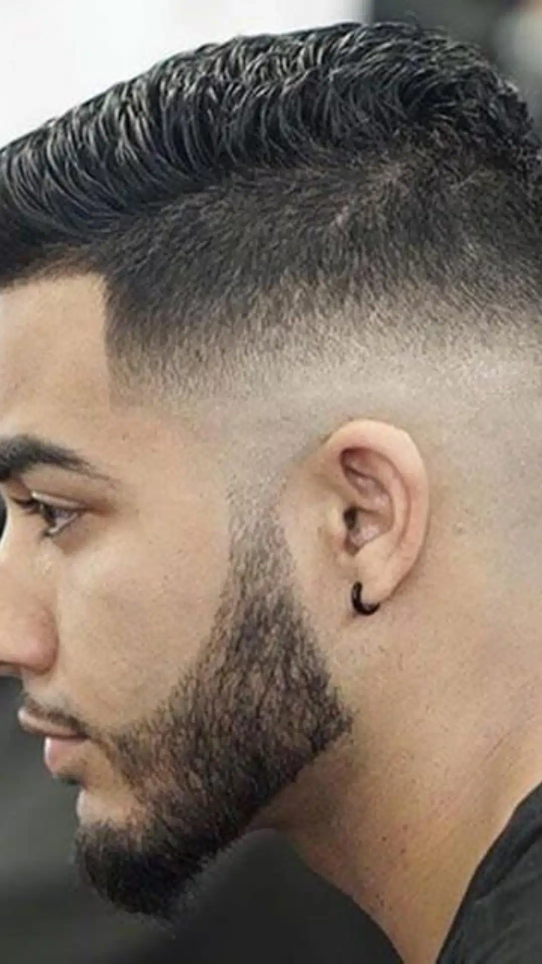 Modern undercut with skin fade and slicked-back top
