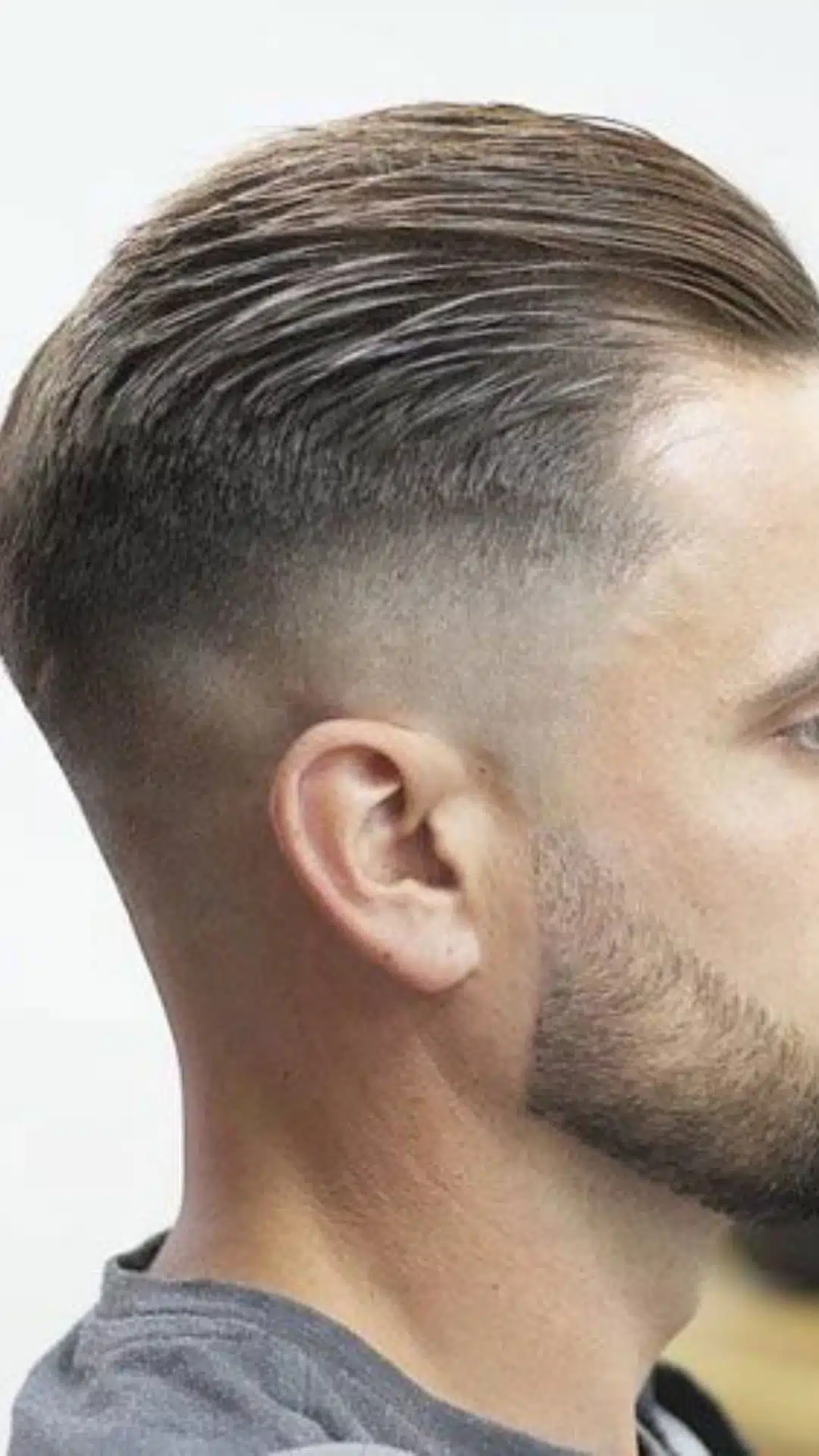 Slick back haircut with skin fade and clean side profile