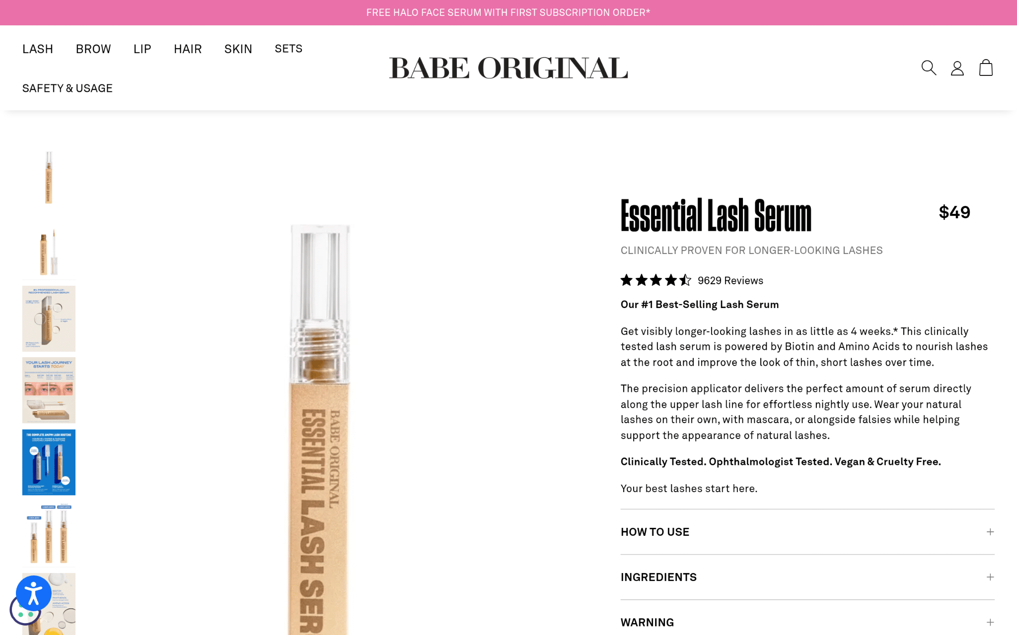 Clear tube of lash serum with beige and gold label against white background